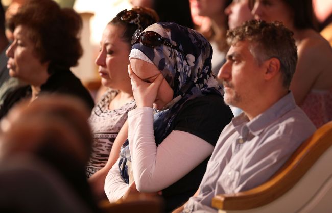 People attend an Interfaith Prayer Vigil at Olivet Baptist Church to honor the four Marines killed during a shooting on July 17, 2015 in Chattanooga, Tennessee. (AFP)