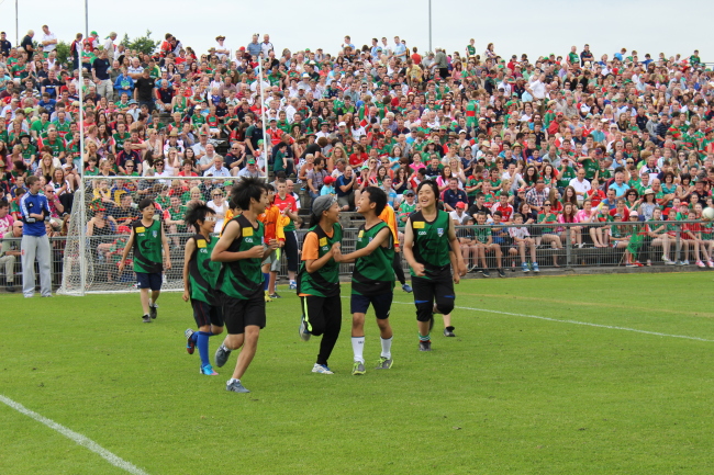 A group of Korean children play an exhibition game of Gaelic football during halftime at the Connaught final at MacHale Park in Ireland as part of a program organized by the Irish Association of Korea to promote the sport. (Seoul Gaels)