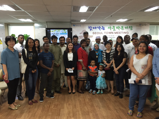 African and Islamic expats at the Itaewon Global Village Center after a town meeting on Friday. (Louisa Studman/The Korea Herald)
