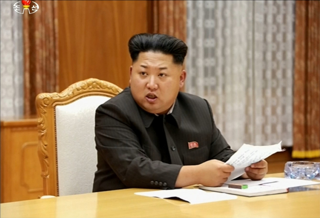 North Korean leader Kim Jong-un presides over an emergency defense meeting last Thursday. (Yonhap)