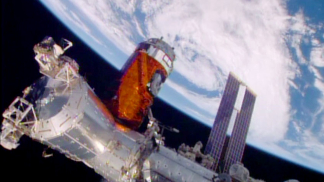 <YONHAP PHOTO-0075> In a photo provided by NASA, a cargo ship from a Japanese company is bolted into place on the International Space Station Monday, Aug. 24, 2015. A Japanese company known for its whiskey and other alcoholic beverages included five types of distilled spirits in the cargo ship that arrived at the space station Monday. The samples will spend at least a year in orbit to see if alcoholic beverages mellow the same in space as they do on Earth. The station? big robotic arm, operated by Japanese astronaut Kimiya Yui, grabbed onto the supply craft launched Wednesday by his homeland. Flight controllers helped anchor it down. NASA also has considerable equipment aboard the supply capsule. (NASA via AP)/2015-08-25 00:22:27/ <저작권자 ⓒ 1980-2015 ㈜연합뉴스. 무단 전재 재배포 금지.>
A cargo ship from a Japanese company is bolted into place on the International Space Station on Monday.   NASA
A cargo ship from a Japanese company is bolted into place on the International Space Station on Monday.   NASA