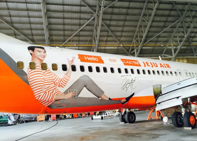 A Jeju Air aircraft sits at a hangar at Jeju International Airport.   Jeju Air