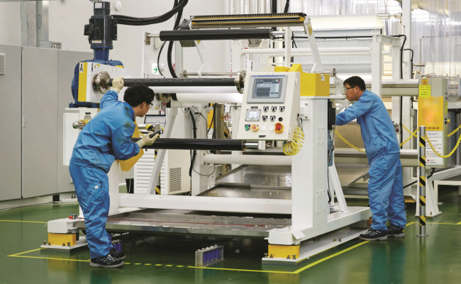LG Chem workers check the production line for membranes for reverse osmosis filters at the company’s plant in Cheongju, North Chungcheong Province.   LG Chem