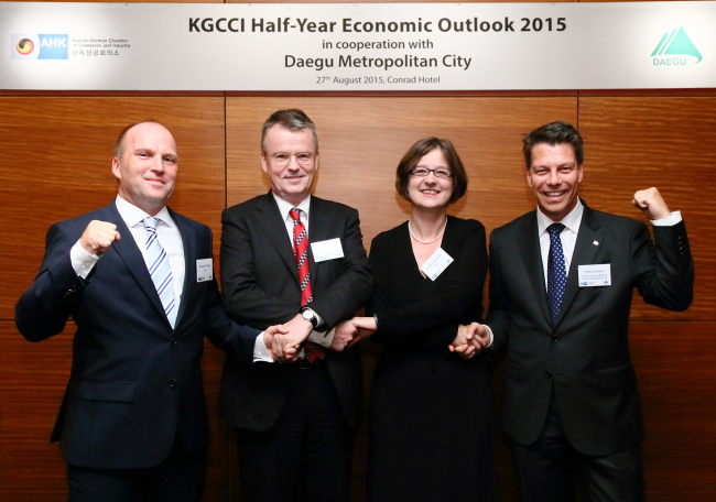 (From left) Rolf Schuster, deputy head of mission from the German Embassy Seoul; Alexander Hirschle, Korean director at Germany Trade and Invest; Barbara Zollmann, secretary general and executive director at the Korean-German Chamber of Commerce and Industry; and Michael Grund, managing director of Merck Korea pose at the KGCCI’s Half-Year Economy Outlook Conference 2015 in Daegu on Thursday.  (Merck Korea)