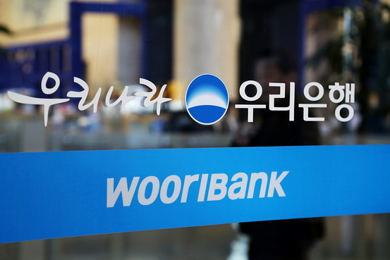 A Woori Bank logo put on a bank branch in Seoul Bloomberg
