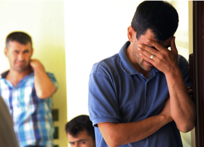 Abdullah Kurdi, 40, father of Syrian boys Aylan, 3, and Galip, 5, who were washed up drowned on a beach near Turkish resort of Bodrum on Wednesday, cries as he waits for the delivery of their bodies outside a morgue in Mugla, Turkey, Thursday. (AP-Yonhap)