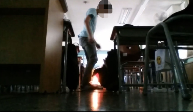 Video footage shows a student igniting an object in a classroom of a school in Yangcheon-gu, Seoul. The video, one of two clips, was reportedly released online three hours after the bombing. Yonhap