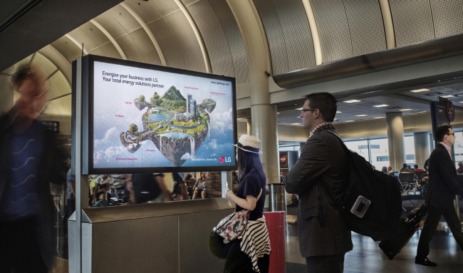 LG PUSHES FOR ENERGY BUSINESS -- LG Group’s affiliates -- LG Electronics, LG Chem, LG CNS and LG Fuel Cell Systems -- have joined forces to promote overseas their energy products, including LED lights, electric car charging infrastructure and energy storage systems. The conglomerate has set up digital signage displays that show commercials for the affiliates’ energy technologies at the Los Angeles International Airport.(LGE)