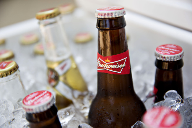 Bottles of Budweiser (right) and Miller beer. (Bloomberg)