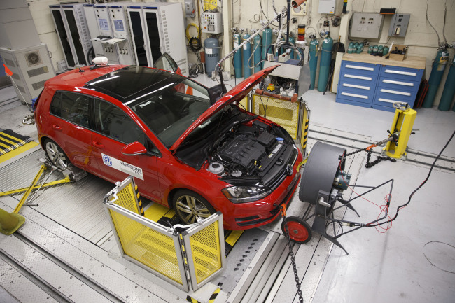 A red 2016 Volkswagen AG Golf TDI emissions certification vehicle waits to be tested inside the California Air Resources Board Haagen-Smit Laboratory in El Monte, California, U.S., on Tuesday, Sept. 22, 2015. The VW vehicles were programmed to activate pollution-control equipment while being tested for compliance with EPA and the California Air Resources Board standards, ensuring that emissions met legal standards; afterward, the car's software switched off the controls so the cars?performance was maximized while allowing far higher pollutant levels. Photographer: Patrick T. Fallon/Bloomberg
A red 2016 Volkswagen AG Golf TDI emissions certification vehicle waits to be tested inside the California Air Resources Board Haagen-Smit Laboratory in El Monte, California, Tuesday.   Bloomberg