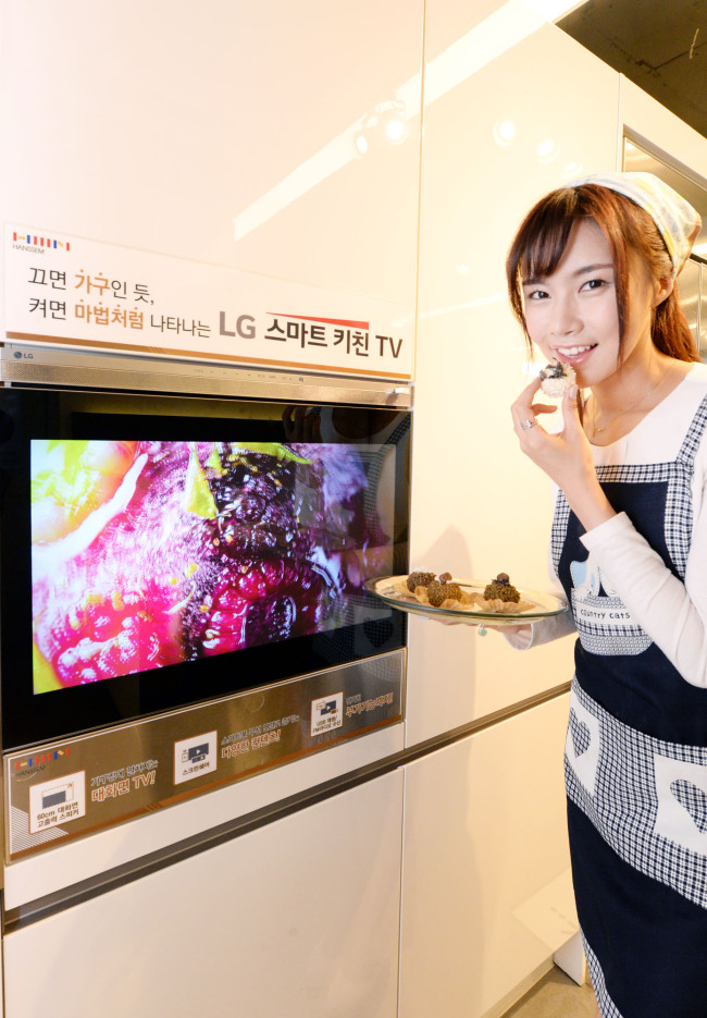 SMART DISPLAY FOR KITCHEN -- LG Electronics and furniture firm Hanssem will release a built-in TV product for the kitchen, dubbed the Smart Kitchen TV, this month in Korea. The smart Kitchen TV, which is installed inside a drawer and displays images on the door of the drawer, boasts a less-intrusive design that allows users to enjoy multimedia content. (LGE)