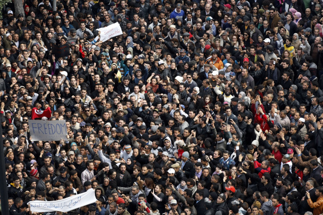 Protesters chant slogans against President Zine El Abidine Ben Aliin during a demonstration in Tunis, in January 2011. (AP)