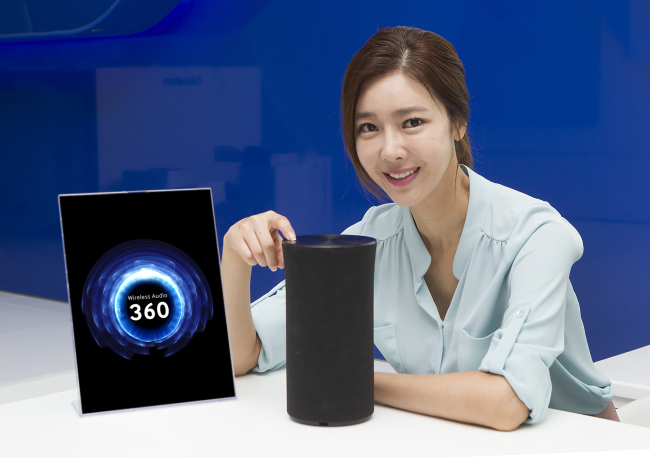 SAMSUNG’S UPGRADED SPEAKER -- Samsung Electronics releases the R1, a wireless cylinder-shaped and omni-directional speaker, which can be linked with smartphones, tablets, and smartwatches. The wireless audio product priced at 199,000 won ($175) features a tap-and-swipe user interface which allows users to control the speaker by tapping and swiping on the top. (Samsung)
