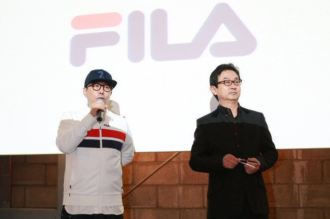 FILA Korea president Kim Jin-myun (right) and executive vice president Jung Ku-ho speak in a media preview of its redesigned products in Seoul on Thursday. (FILA Korea)