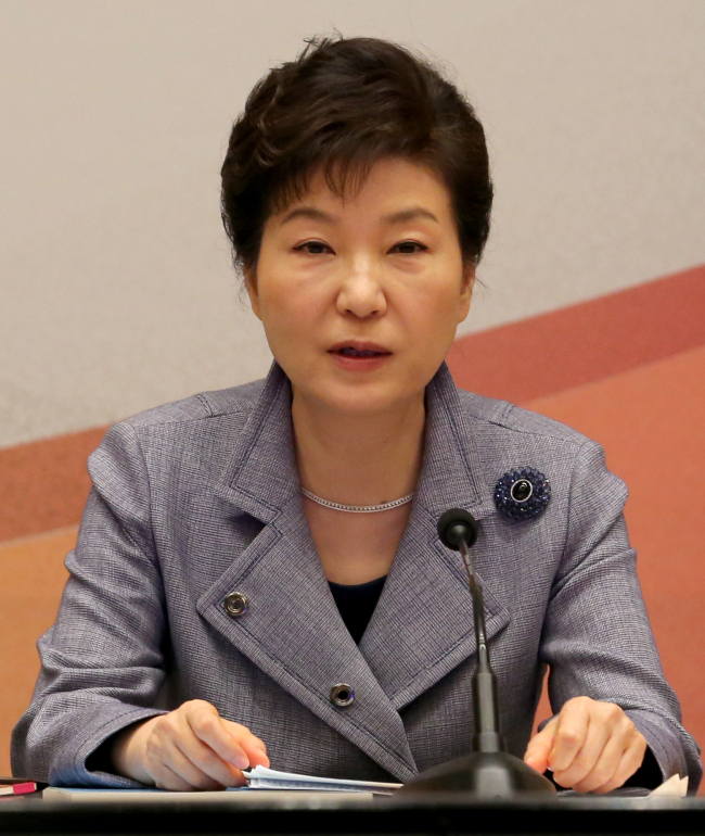 President Park Geun-hye speaks at a meeting with the members of presidential preparation committee for unification held at the Blue House on Thursday. (Yonhap)