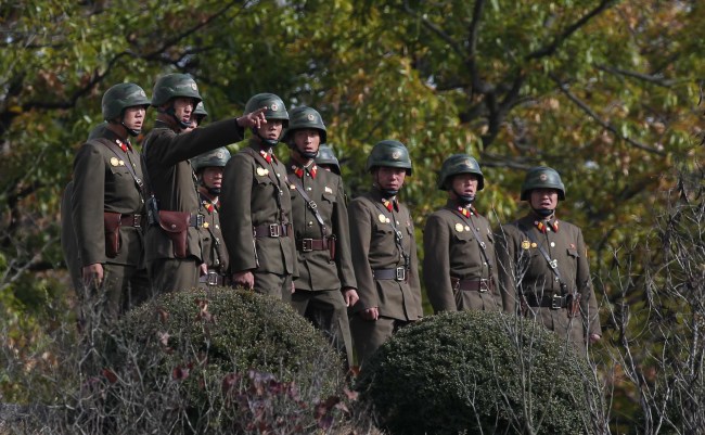 North Korean troops stand at the inter-Korean border village of Panmunjeom on Sunday. (Yonhap)