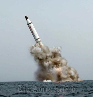 An image published in North Korea’s Rodong Sinmun newspaper on May 9 shows a ballistic missile believed to have been launched from underwater. (Yonhap)