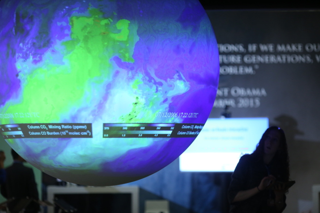 An illuminated globe hangs in the U.S. pavillion at the United Nations COP21 climate summit at Le Bourget in Paris, France, Friday. (Bloomberg)