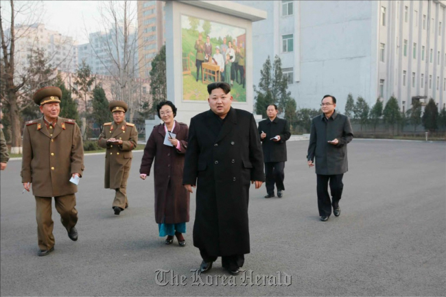 This image carried by the Rodong Sinmun, North Korea's ruling Workers' Party's mouthpiece, shows leader Kim Jong-un (third from right) inspecting the Phyongchon Revolutionary Site in Pyongyang. (Yonhap)