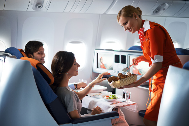 An Aeroflot flight attendant services customers aboard a flight.
(Aeroflot Russian Airlines)