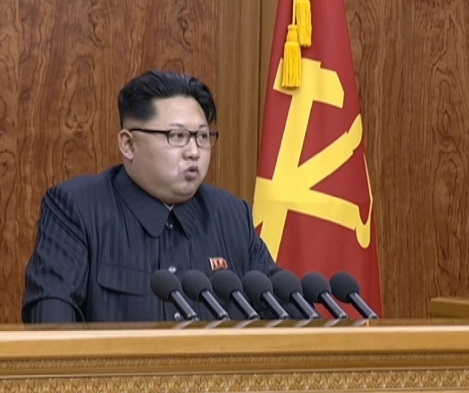 North Korean leader Kim Jong-un delivers his New Year's message live on the North's television on Friday. (Yonhap)