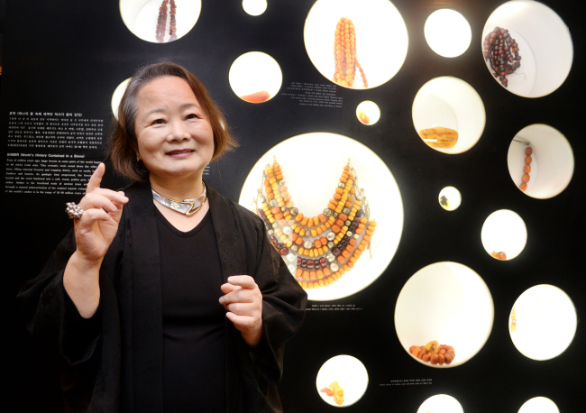 Lee Kang-won, director of the World Jewelry Museum, poses with her collection at the museum in Hwa-dong, Seoul. Park Hyun-koo/The Korea Herald
