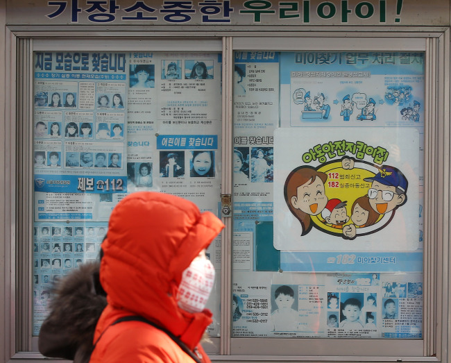 A bulletin board is filled with fliers looking for missing children near Cheongnyangri Station in Seoul.  Yonhap