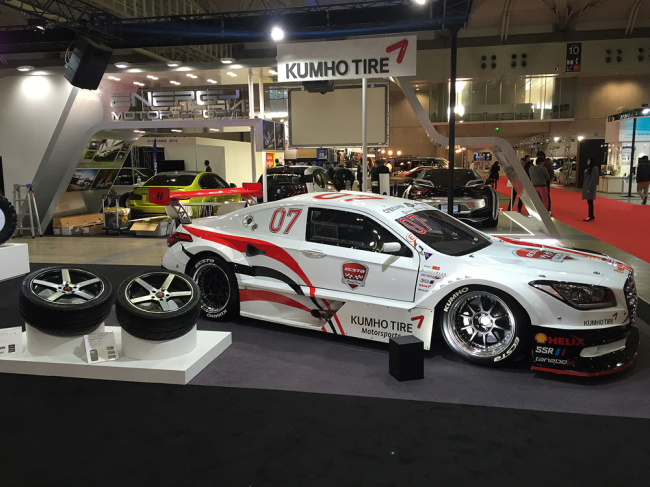The booth of Kumho Tire at Tokyo Auto Salon 2016 displays a racing car fitted with the firm’s UHP tires and various tire solutions.    Kumho Tire