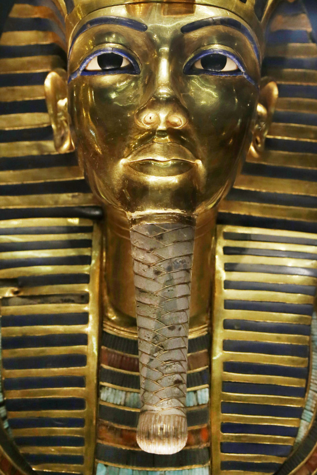 The gold mask of King Tutankhamun is seen in a glass case during a press tour, in the Egyptian Museum near Tahrir Square, Cairo. (AP-Yonhap)