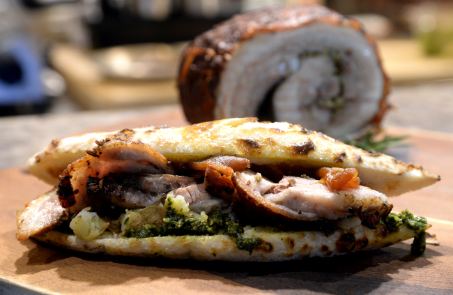 Bistro Piuzza’s porchetta panino is crafted with fennel seed-spiced pork belly that has been slow roasted for over three hours. (Park Hyun-koo/The Korea Herald)