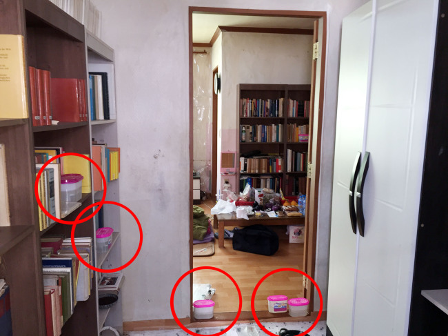 The room where the mummified body of the teenage girl was found, surrounded by dehumidifying agents placed inside the room. (Yonhap)