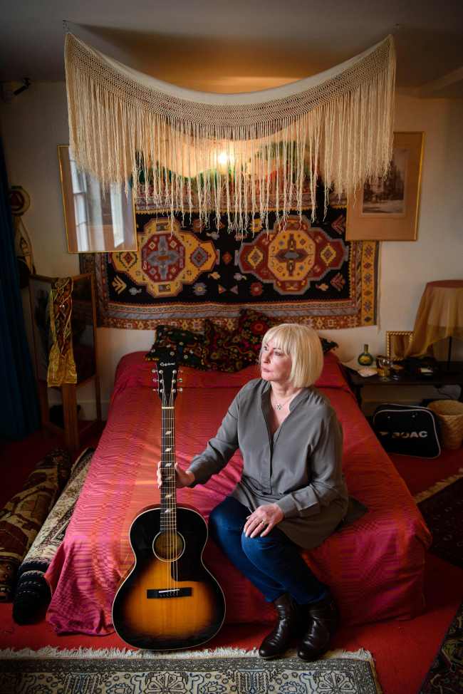 Kathy Etchingham, the former girlfriend of U.S. musician Jimi Hendrix, poses for photographs in his former bedroom in central London, on Feb. 8, 2016, to promote a forthcoming exhibition. (AFP-Yonhap)