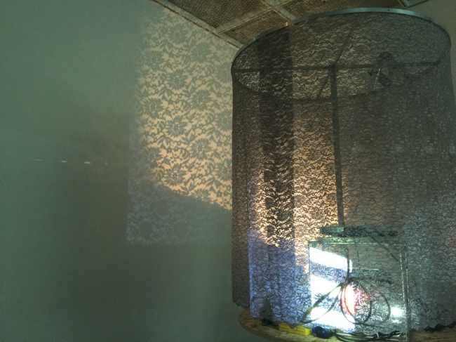 “Dongjungdong 2,” a moving cylindrical installation that projects lace patterns onto a wall, by Lee Ye-seung (Artside Gallery)