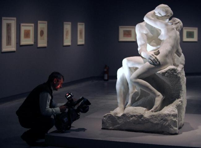 A bronze cast of this original Auguste Rodin sculpture “The Kiss” has sold for 2.2 million euros ($2.4 million) to an American collector (AFP)