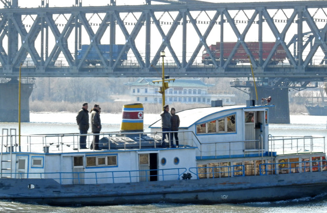 North Korean citizens sail on a boat on Amnok River that borders China on Tuesday. (Yonhap)