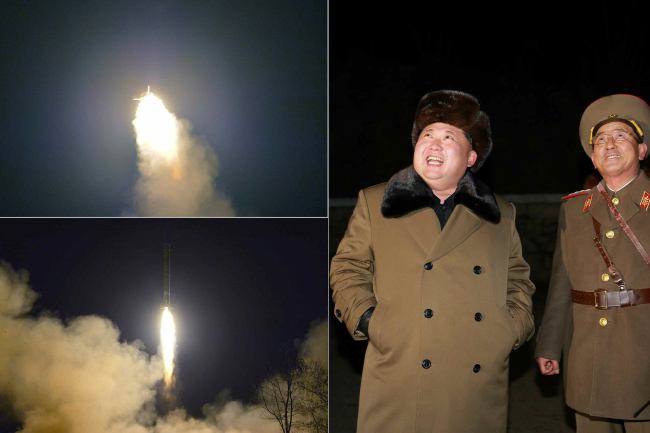 In this image carried Friday by the Rodong Shinmun, North Korean leader Kim Jong-un (left) observes the test launch of short-range missiles on Thursday. (Yonhap)