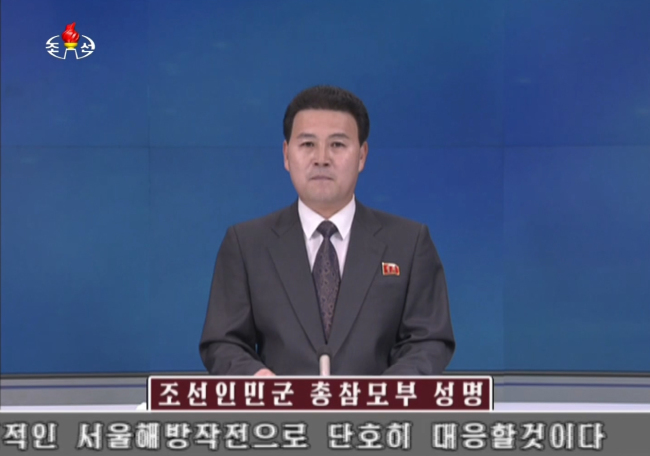 An anchor of the North`s official Korean Central Television announces a statement from the General Staff of the Korean People`s Army on Saturday, threatening a preemptive attack and "liberation" operation on Seoul. (Yonhap)