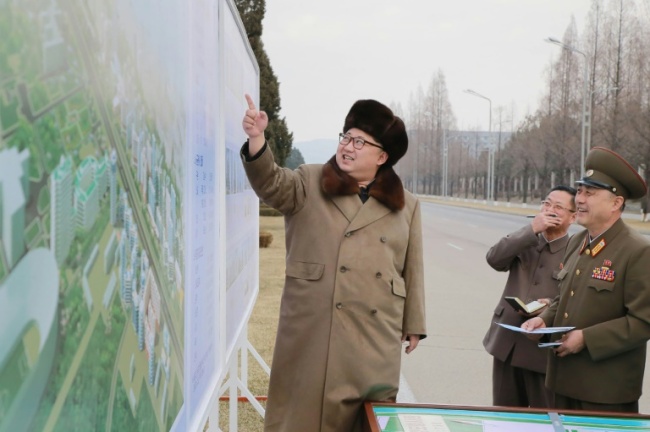 Picture released from North Korea's official Korean Central News Agency shows North Korean leader Kim Jong-Un guiding the construction of Ryomyong Street in Pyongyang. AFP-Yonhap