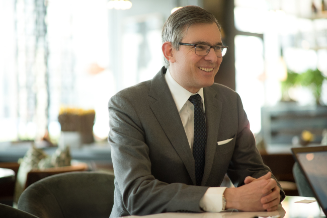 Michael Kliger, president of mytheresa.com, talks during an interview on Monday in Seoul. (Scott Jung)