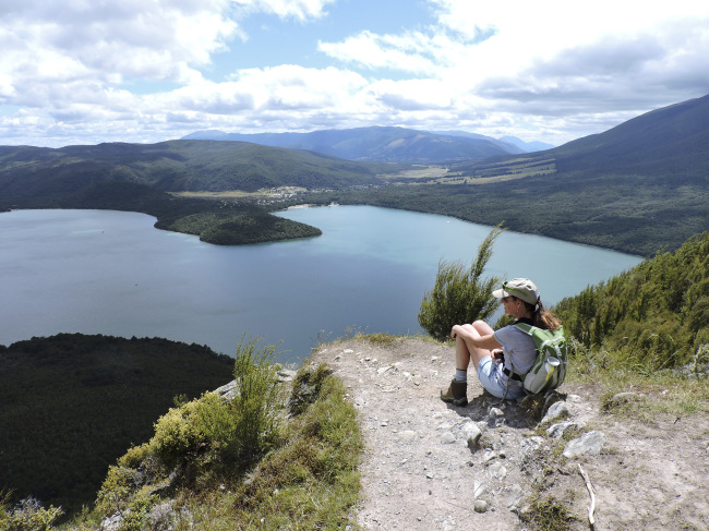 A hiker enjoys the view of Lake Rotoiti near the top of Mount Roberts in New Zealand. (Orange County Register/TNS)
