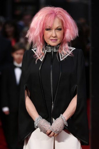 U.S. singer Cyndi Lauper poses on the red carpet upon arrival to attend the 2016 Laurence Olivier Awards in London on Sunday. (AFP-Yonhap)