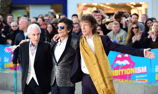 From left: Charlie Watts, Ronnie Wood and Mick Jagger of The Rolling Stones arrive for the opening night gala for “Exhibitionism: The Rolling Stones” exhibition held at the Saatchi Gallery, London, Monday. (EPA-Yonhap)