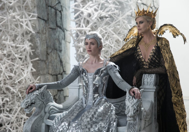 Emily Blunt (left) and Charlize Theron in “The Huntsman: Winter’s War” (Universal Pictures)