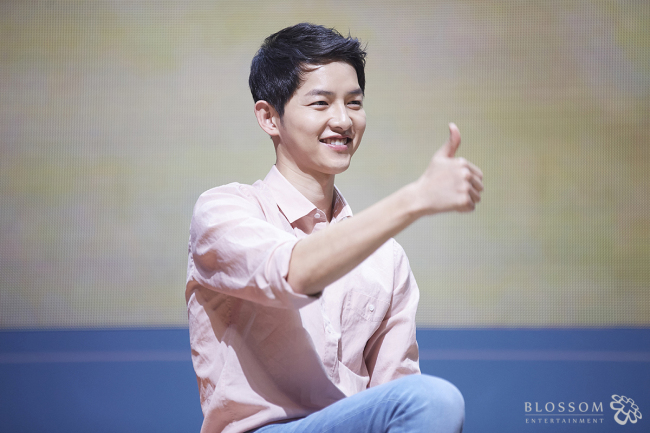 Song Joong-ki speaks at a fan meeting in Seoul on April 18. (Blossom Entertainment)