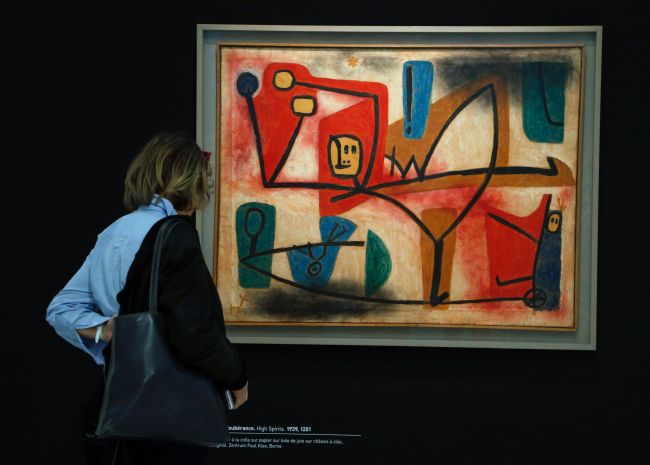 A visitor watches “High Spirits”, a mixed media painting by German artist Paul Klee, during a press preview at the Georges Pompidou Cultural and Art Center on April 5, in Paris. (AFP-Yonhap)