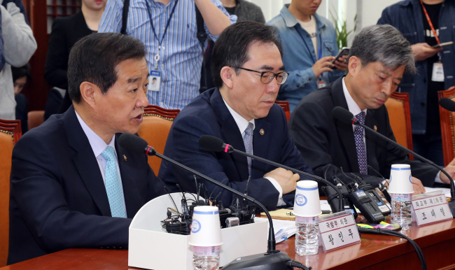 Vice Defense Minister Hwang In-moo (left) speaks during a National Security Council held Thursday at the National Assembly in Seoul. / Yonhap