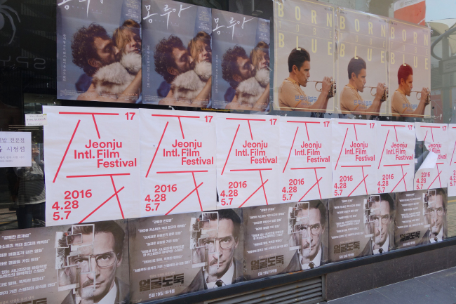 Posters line the walls of buildings on Jeonju’s Cinema Street on Thursday. (Rumy Doo/The Korea Herald)