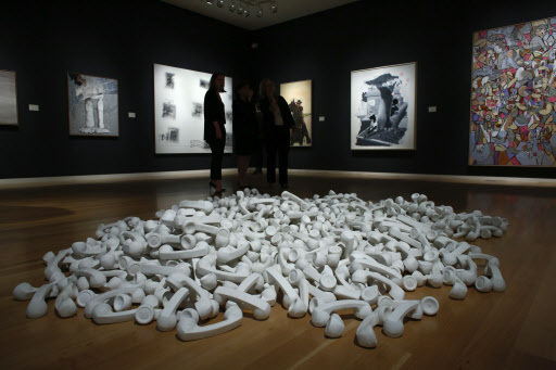 People stand next to the artwork “Boneyard” by artist Christian Marclay during a press preview on April 29 in New York. (AFP-Yonhap)