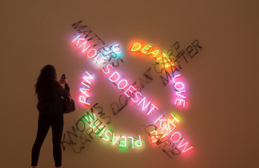 A woman takes a photo of an art piece inside the San Francisco Museum of Modern Art in California on Saturday. (AFP-Yonhap)