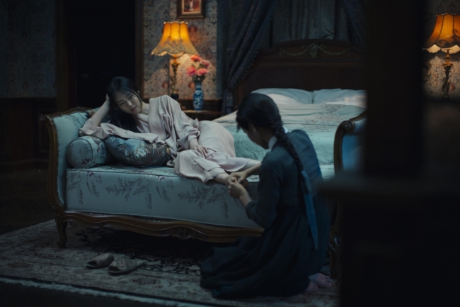 A still from “The Handmaiden,” featuring Kim Min-hee (left) and Kim Tae-ri (CJ E&M)